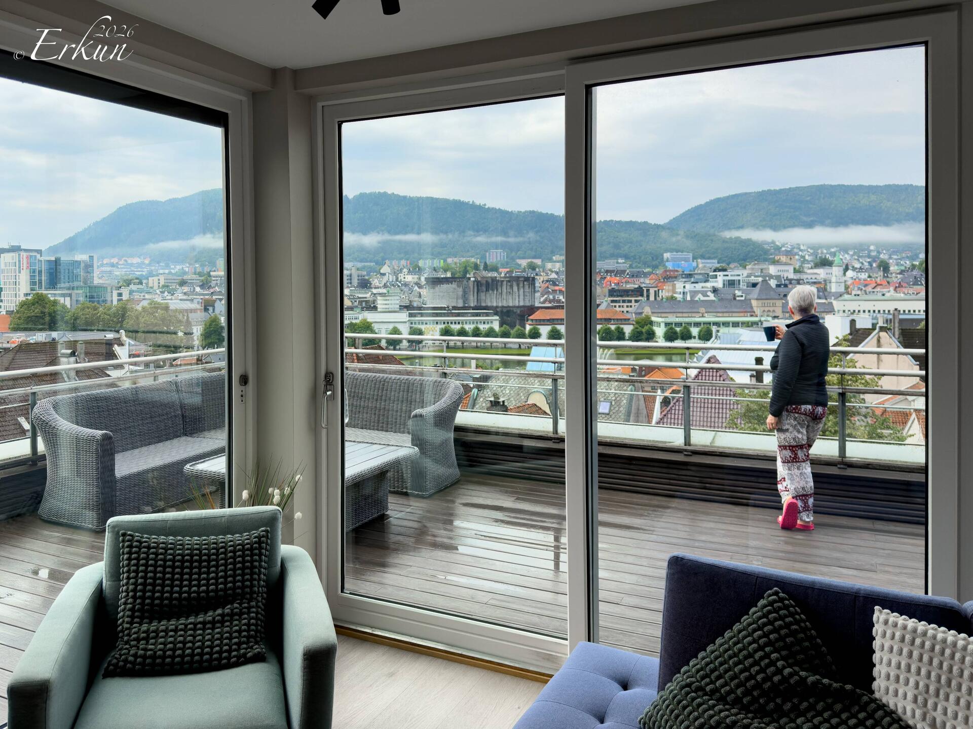 When the rain lets up, I head out to enjoy a cup of tea on the terrace — Bergen, Norway.