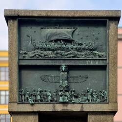 Seamen's Monument; relief panels ... Viking longships (top); encounters with indigenous Americans.