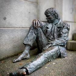 "Homeless" ... sits on the corner on the street ... outside an expensive shopping mall — Bergen.