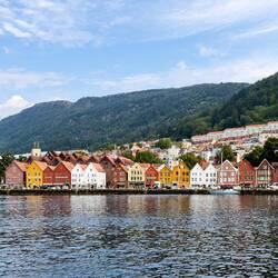 The colorful buildings form the iconic wharf of Bryggen — Bergen, Norway.