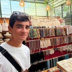 Eashan at a local market . He seemed to enjoy bargaining !