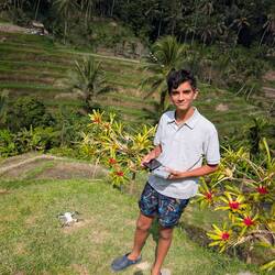 Eashan using his drone on the paddy field