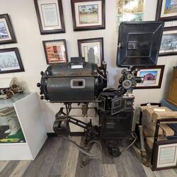 That's a silent movie projector from early 1900s