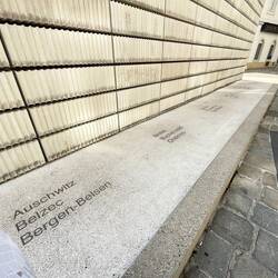 Around the other sides names of all concentration camps