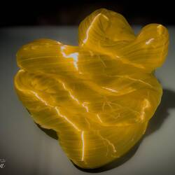 "Twisted Folds" (M. Band Espersen; 2021) ... stretched and folded yellow glass — Kode Art Lysverket.