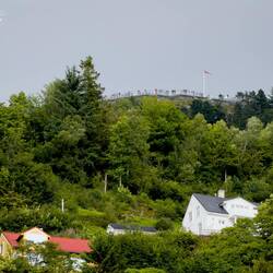 The Mount Fløyen viewing terrace is visible from the apartment this evening — Bergen, Norway.