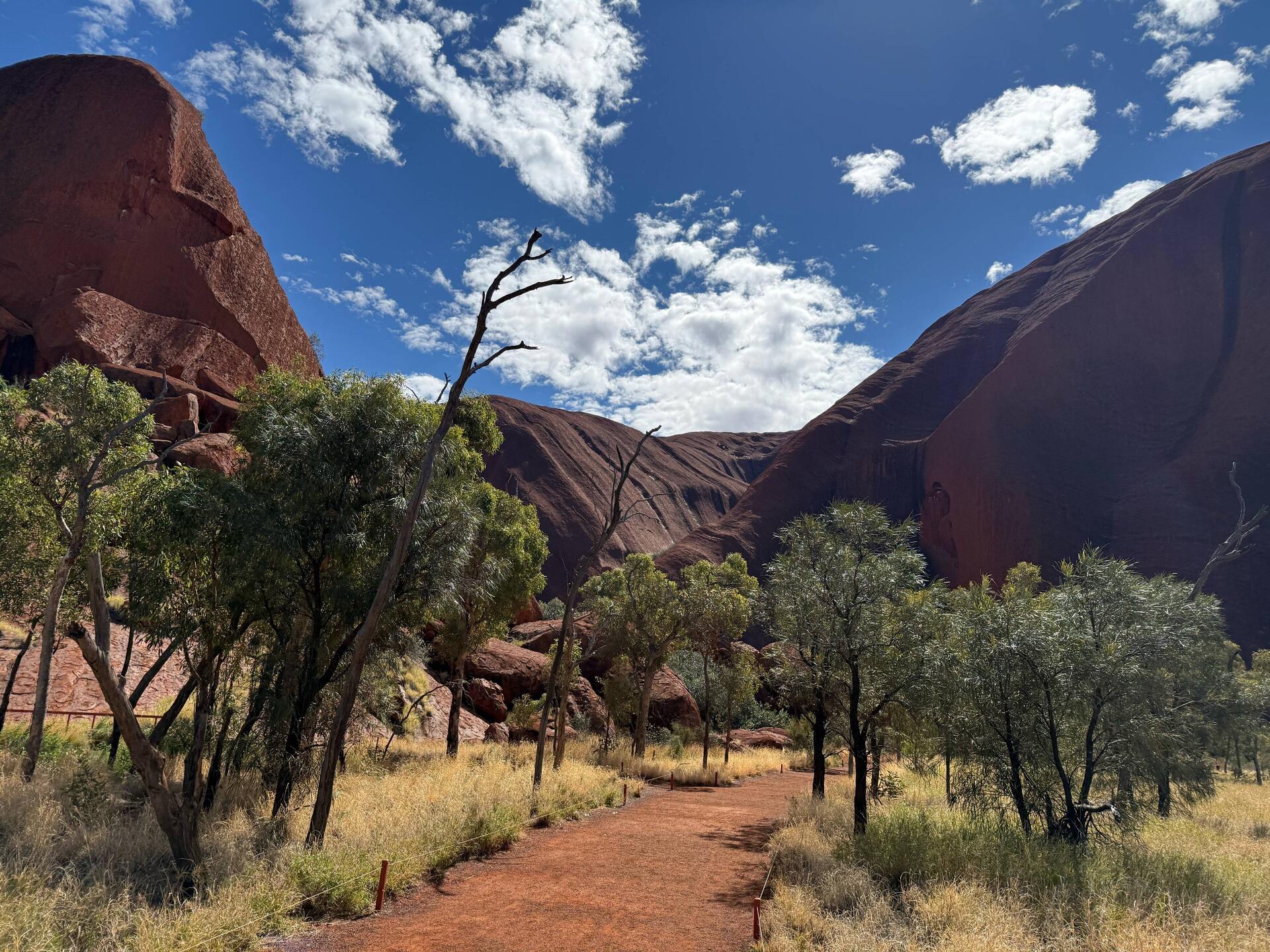 The Muṯitjulu Waterhole is at the bottom of these valleys