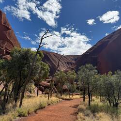 The Muṯitjulu Waterhole is at the bottom of these valleys