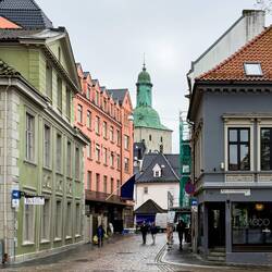 Streetscape with the the steeple of the Domkirken — Bergen, Norway.