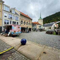 Wider view of Korskirken Square ... Pygmalion behind the gelato truck — Bergen, Norway.