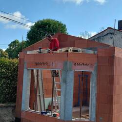 Patrick, the carpenter gets the roof started on the bay window