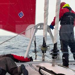 The captain keeps an eye on the crew.