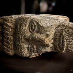 Column capital reused in a wall; found in a grave in Bergen Cathedral — Bryggens Museum, Bergen.