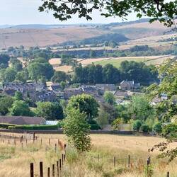 View down to Eyam ascending Eyam Edge