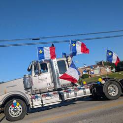 On Aug 15, Acadians walk and drive around making as much noise as they can so you don't forget them