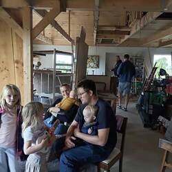 Malte nursing Dirch, with Mia, 2 daughters and 4 month old son