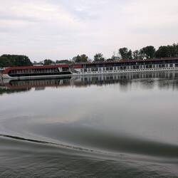 A luxury riverboat going upstream