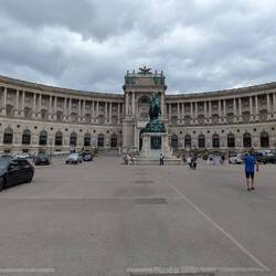 the grand Neue Burg wing of the Hofburg Palace at Heldenplatz square in Vienna.