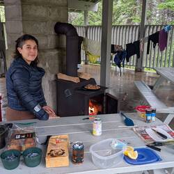 Heating our meal on the wood stove (success), drying our clothes and boots (failure)
