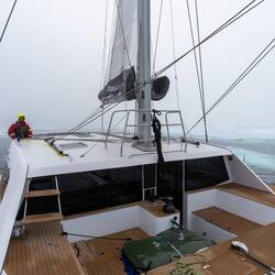 The main sail comes down in a minute.