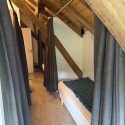 Privacy curtains. You MUST have a sleepsack or bag