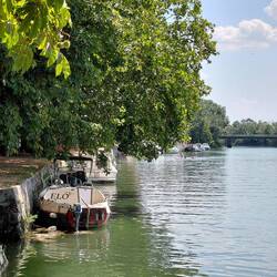 More boats moored on the river