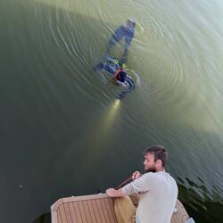 Recovering a dropped piece of hardware from the ground. Nice water, ehh?