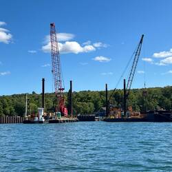 View of the construction cranes on the outside of the harbor.
