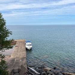 Looking down at the dock and C-Traveler from the top step. Water pretty calm.