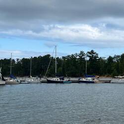 More sailboats on the other dock, with one large cabin cruiser.
