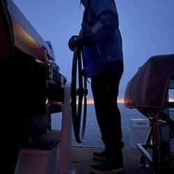 Yann at the helm as dawn sets.