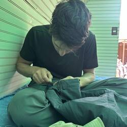 Sal fixing my pants when we arrived at our accom