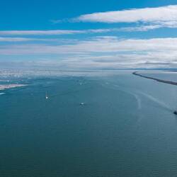 Magically, near the coast is an ice-free strip, perfect for navigation.