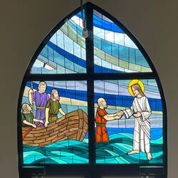 Stained glass window above door at St. John's United Church of Christ.