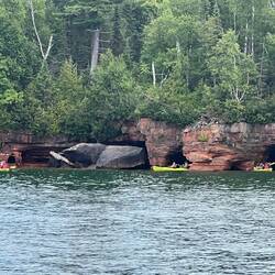 A group of the kayaks by the smaller sea caves.