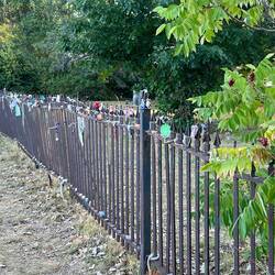 Interesting pieces of cloth left along the cemetery fence.