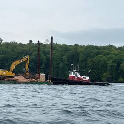 Construction barge and tug heading south around Pt. Detour.
