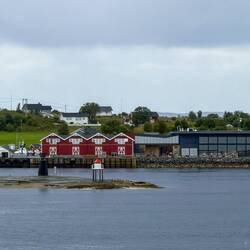 The hamlet on Indre Kvarøy Island ... with the peak of Hestmannen visible in the background.