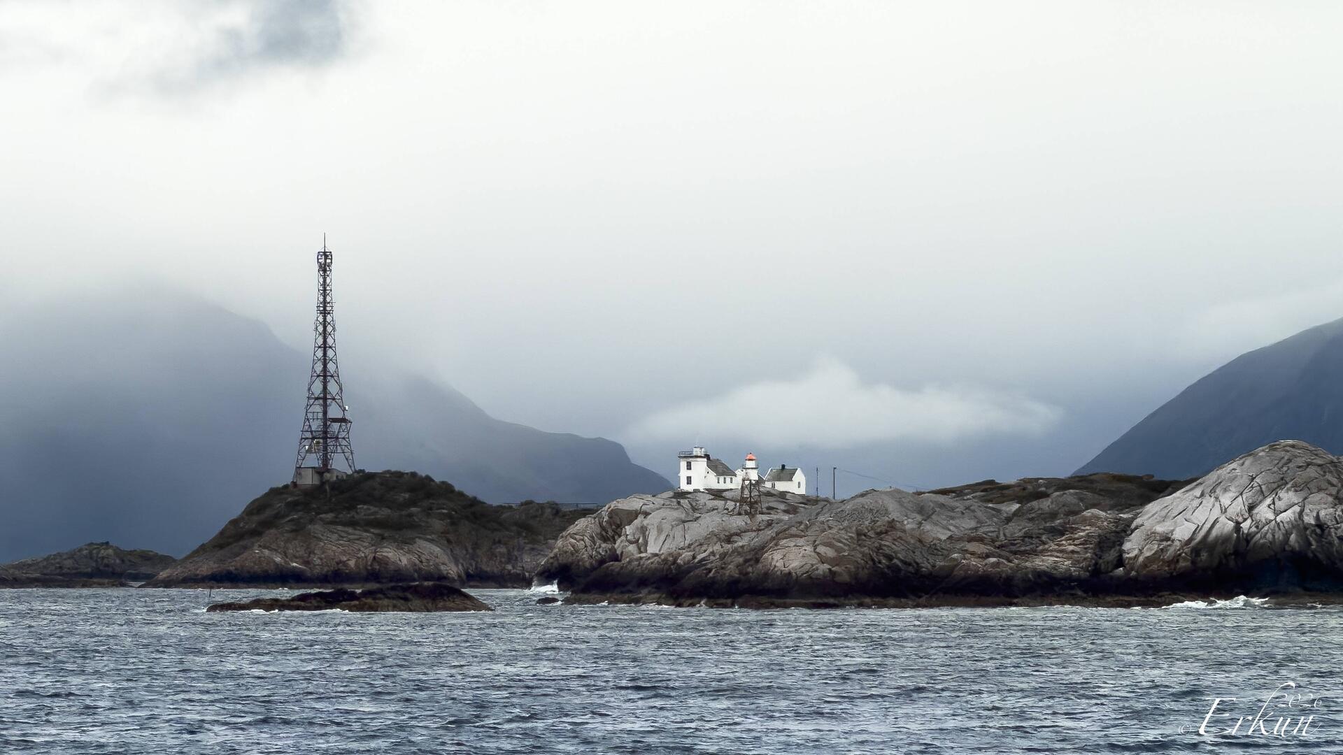 Henningsvær's old (square) and new (red roof) lighthouses — en route to Svolvær.