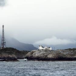 Henningsvær's old (square) and new (red roof) lighthouses — en route to Svolvær.