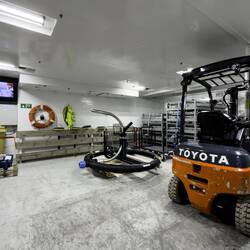 The ship has its own forklift to move cargo around.