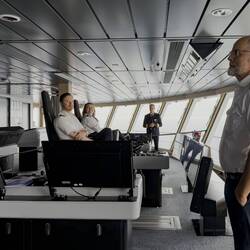 Captain Bruland welcoming us; the first and second mate on duty; first mate has steering control.