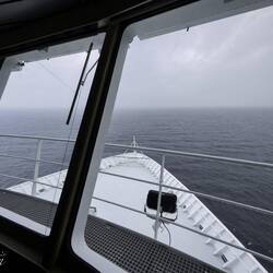Looking out through the forward windows of the bridge.
