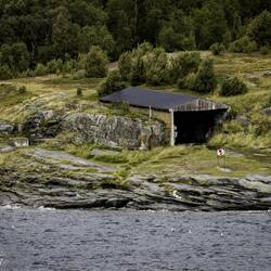 Looks like someone used natural rock formations as the walls for a shed.