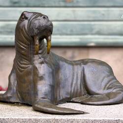 Near the Polarmuseet; walrus sculpture honoring the region's historic ties to Arctic marine mammals.