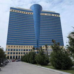 Baku - impressive building of the Hilton with the rotating bar 360 degrees on the top
