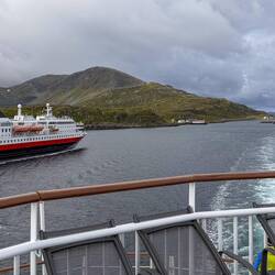 Hurtigruten's Nordlys passes us on its southbound journey as we continue north.