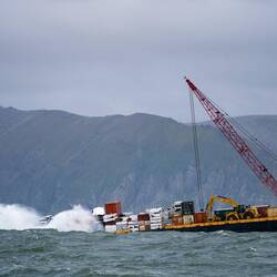 "Sure, we secured your new car securely at the front of the barge."