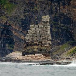 Closer look at one of the sea cliff formations that make up Finnkirka and a sea cave.