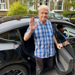 Waving goodbye as I leave my daughter's for the airport - I do have two legs, honest